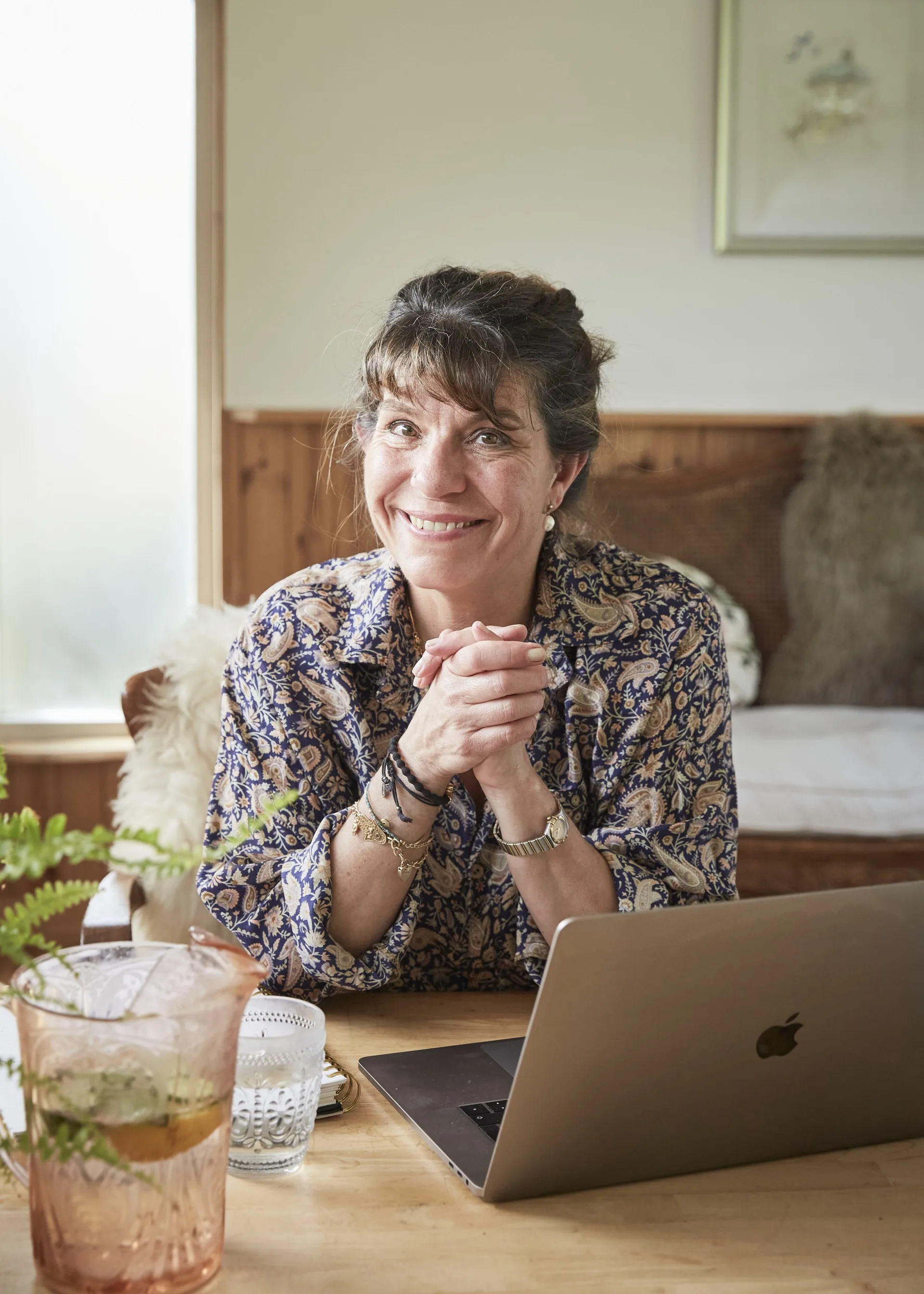 Charlotte Hastings smiling at her laptop