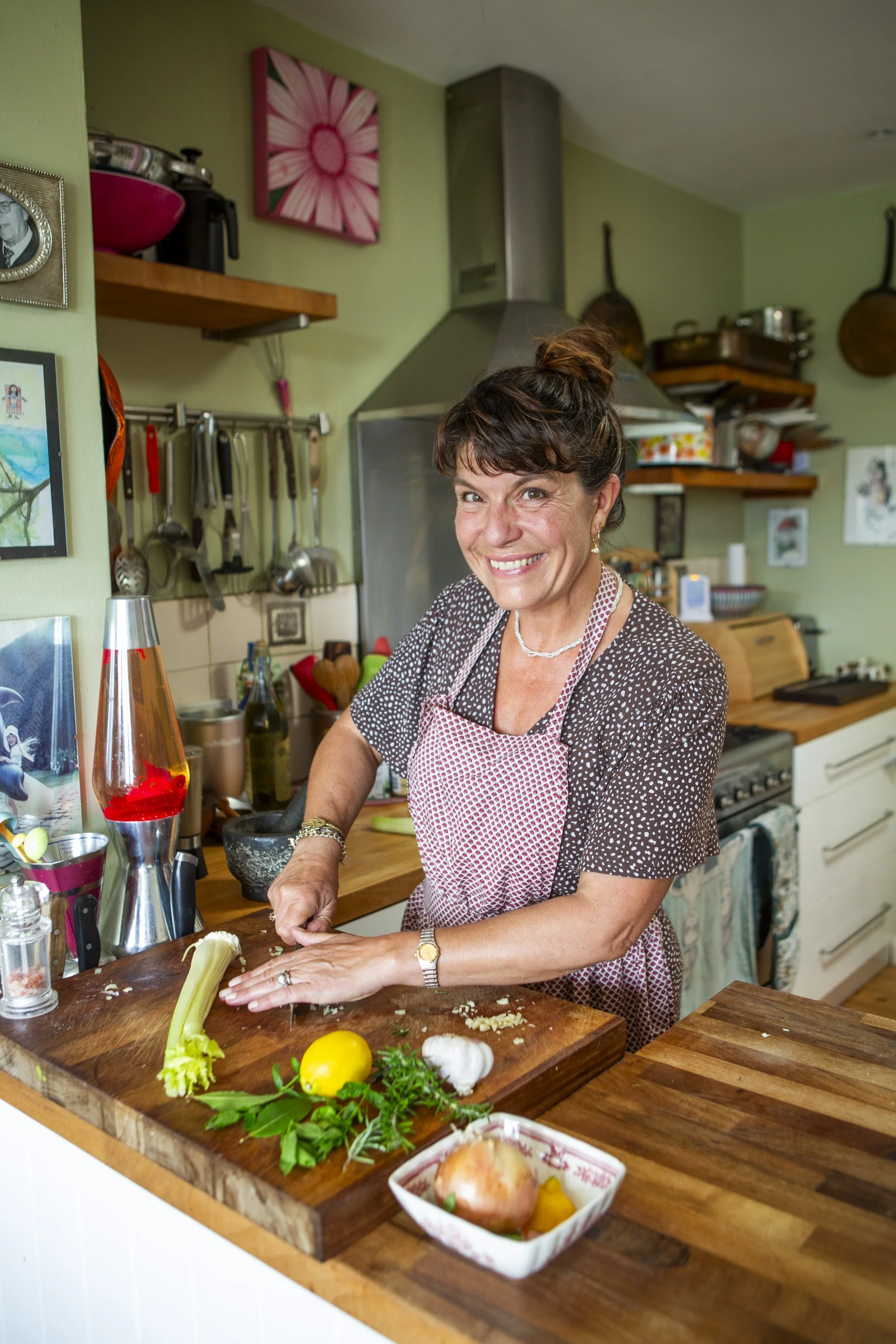 Charlotte Hastings preparing food in her kitchen
