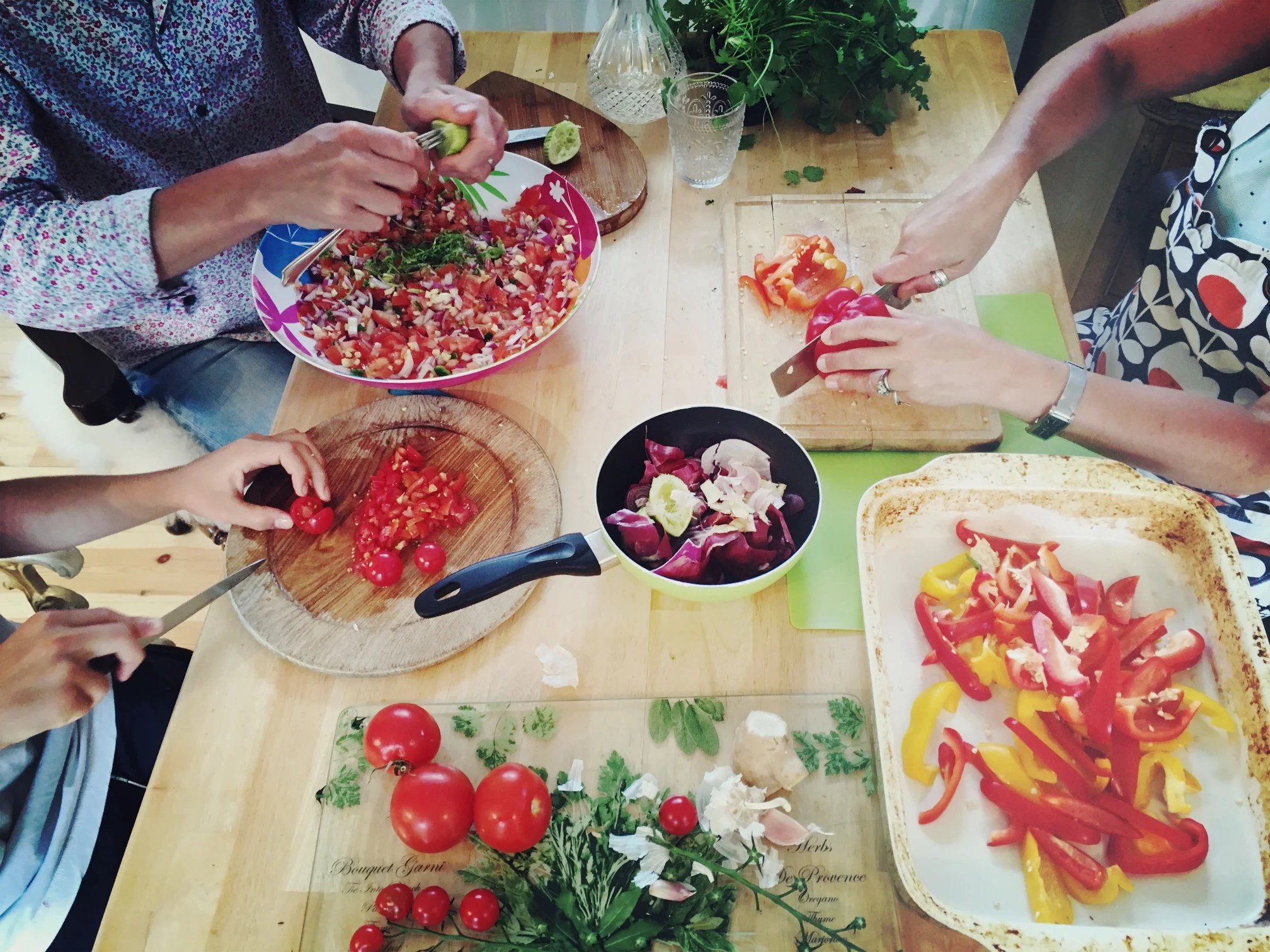 Group chopping vegetables in a workshop